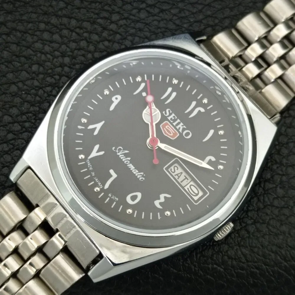 Vintage 1976 Seiko Automatic Mens Silver Watch W/daydate & Black accents